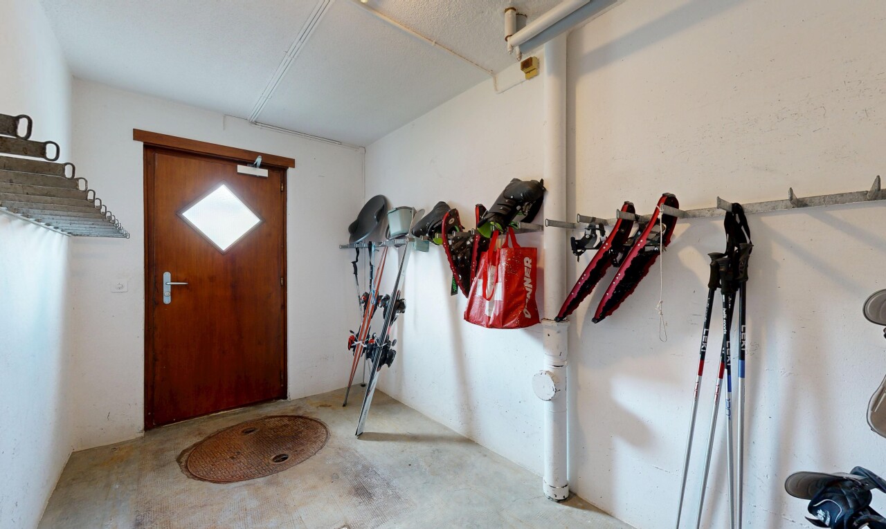 hallway with unfinished concrete flooring