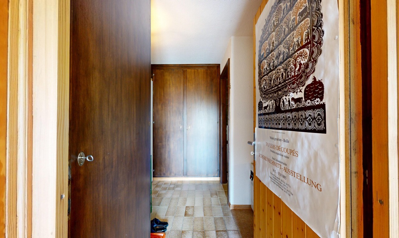 hallway featuring baseboards