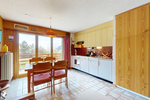 dining area featuring a textured ceiling and light flooring