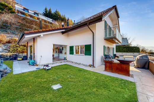 view of home with stucco siding and a patio