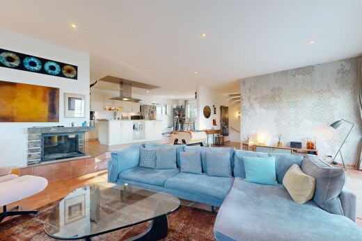 tiled living room with wallpapered walls, a fireplace, and recessed lighting
