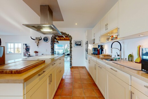 kitchen featuring island exhaust hood, wooden counters, light tile patterned floors, white cabinets, and recessed lighting