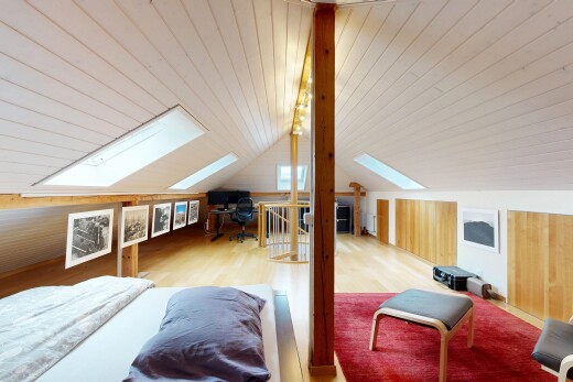 room / bedroom featuring lofted ceiling with skylight, an office area, wood finished floors, and wooden ceiling