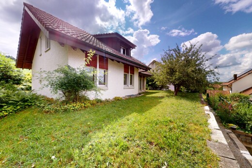 außenansicht mit stuckverkleidung, property visible, und rasen