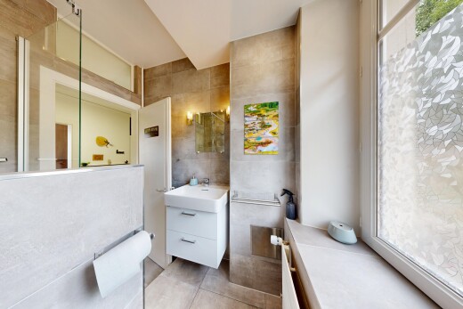 bathroom with tile walls and vanity