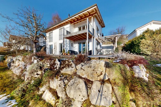 outdoor house featuring a balcony and a patio