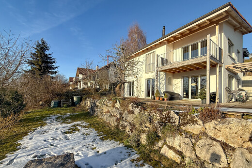 view of property with stucco siding, a balcony, and a patio area