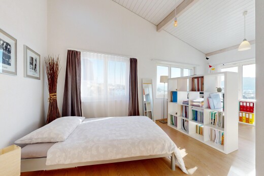 room with beam ceiling, wood finished floors, and high vaulted ceiling