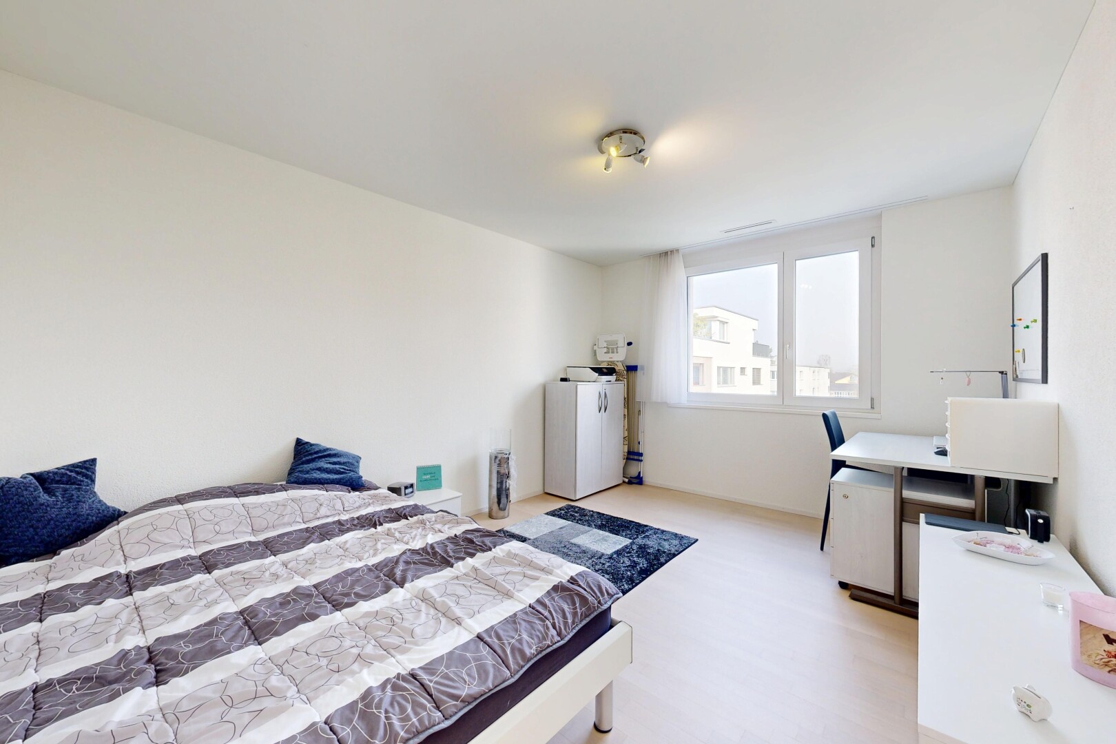 room with light wood-type flooring and washer / clothes dryer