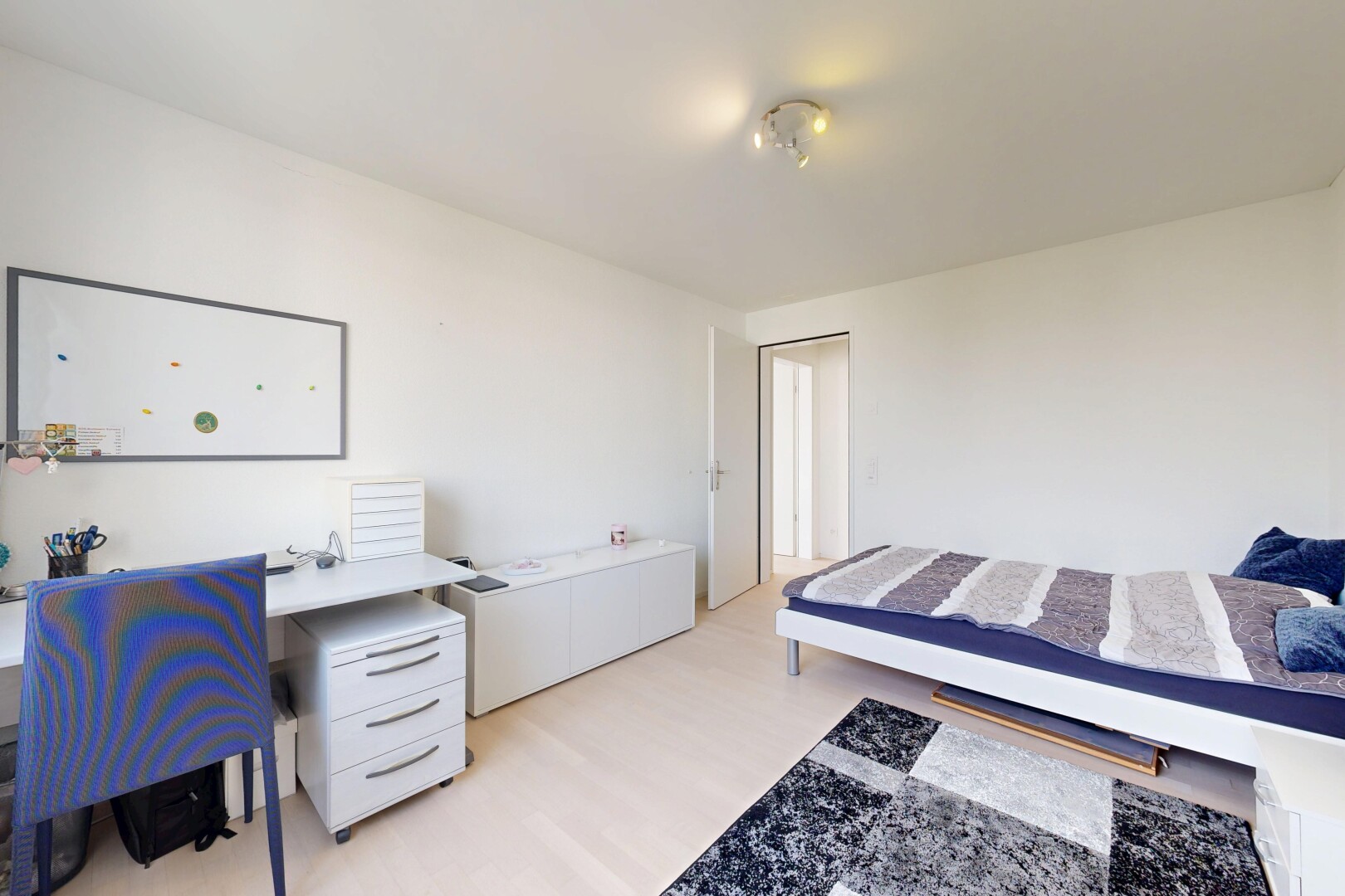 room featuring light wood-style floors and an office area