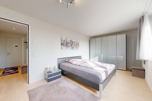 room with light wood finished floors and recessed lighting