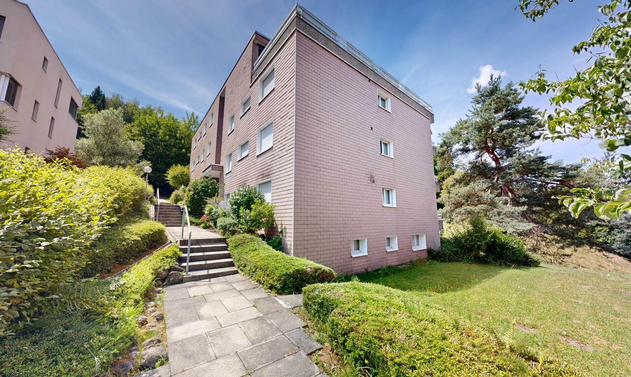 view of apartment building / complex featuring stairway