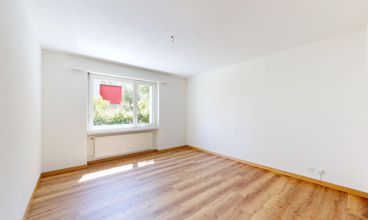 empty room featuring light wood-style floors and baseboards