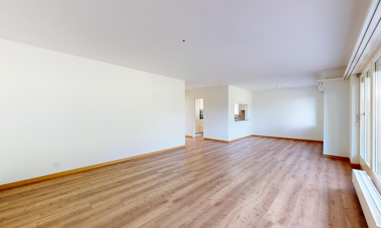 spare room with light wood-style floors and baseboards