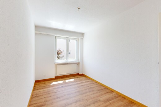 spare room with light wood-type flooring and baseboards