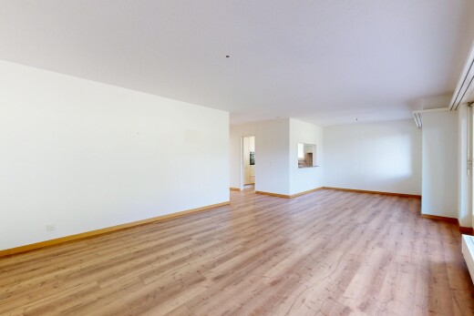 spare room with light wood-style floors and baseboards