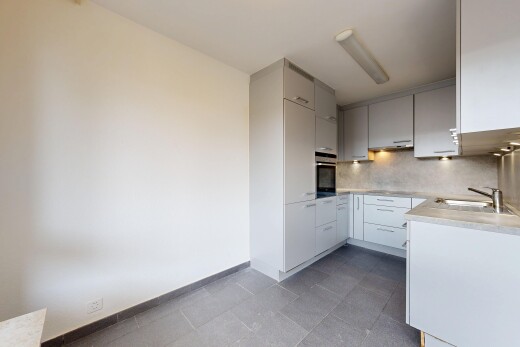 cuisine avec plans de travail, light countertops, cloison sèche, drywall, et dosseret