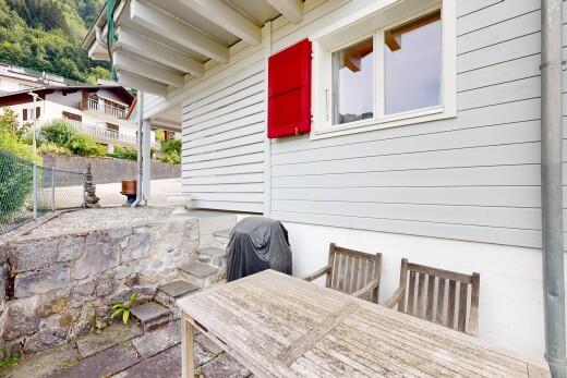 terrace with outdoor dining space, a grill, and a patio area
