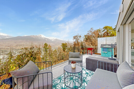 patio / terrace with outdoor seating and a mountain view