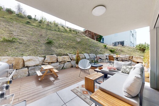 terrace with outdoor furniture, area for grilling, and a patio area