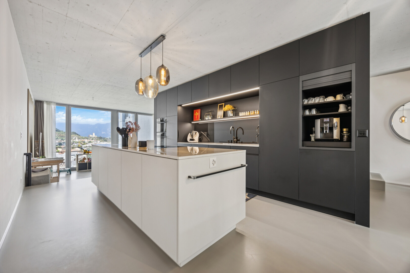 küche mit schränke mit flachen paneelen, flat panel cabinets, finished concrete floor, pendant lighting, und kücheninsel