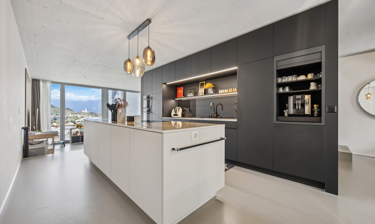 küche mit schränke mit flachen paneelen, flat panel cabinets, finished concrete floor, pendant lighting, und kücheninsel