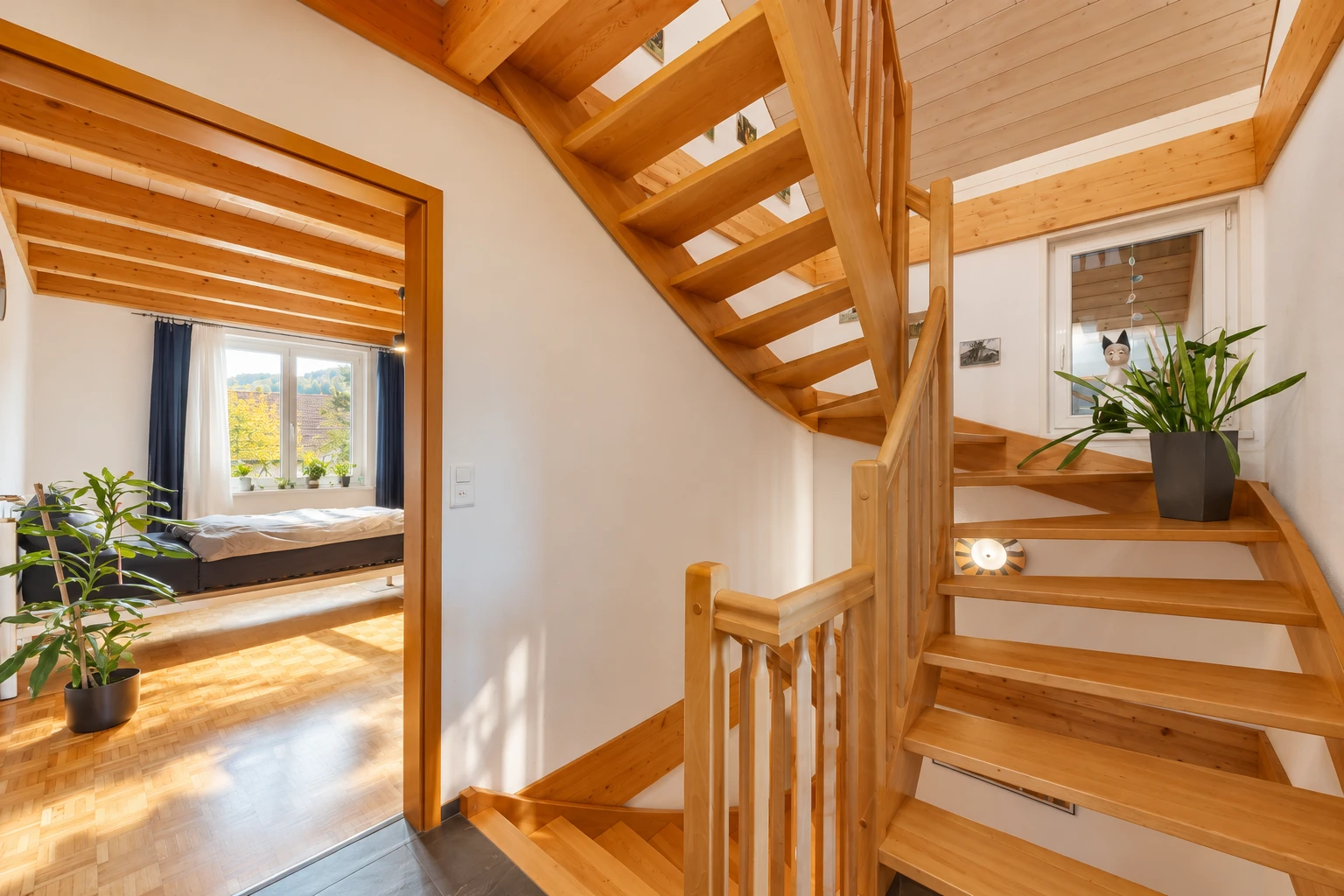 staircase with wood finished floors