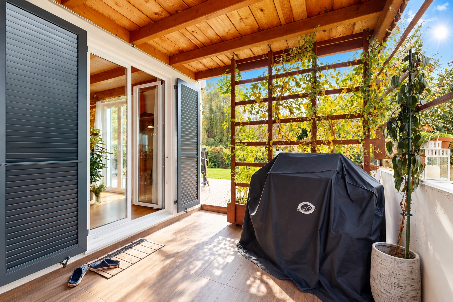 patio / terrace with a sunroom and a grill