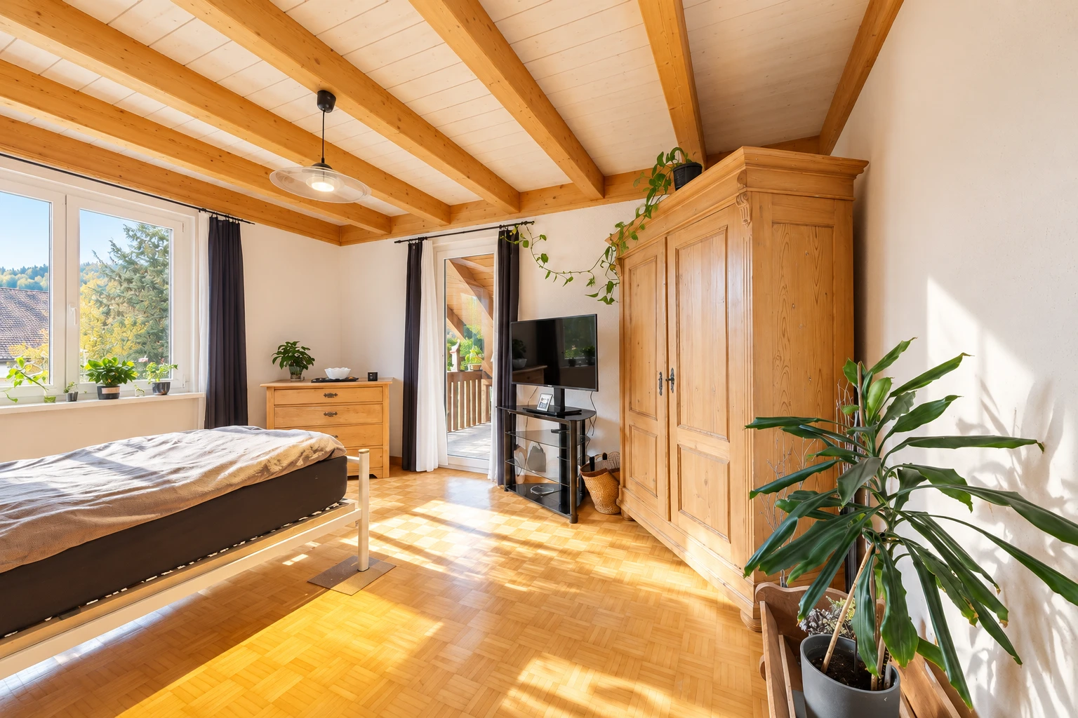 room with access to exterior, beam ceiling, parquet floors, and decorative light fixtures