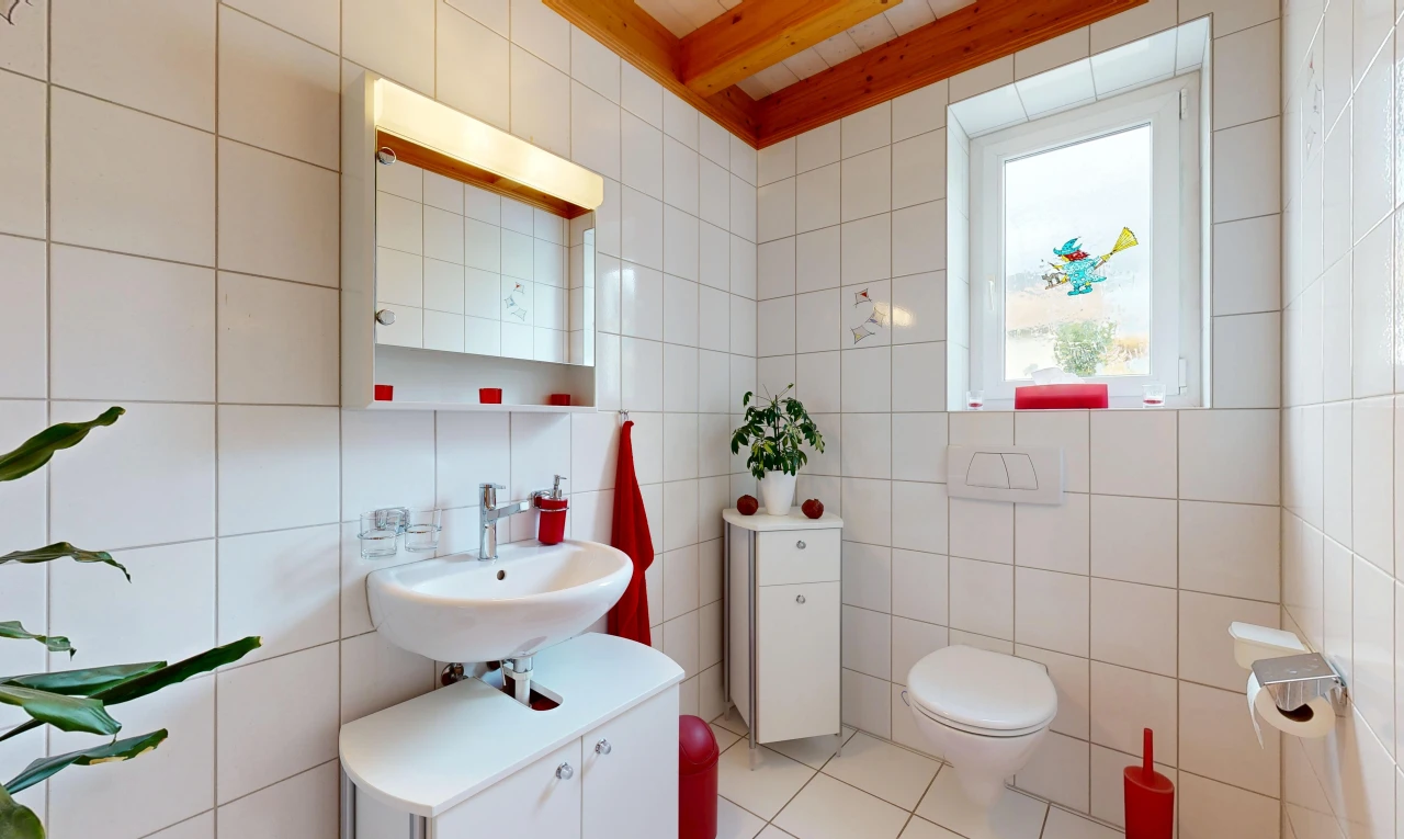 half bath with tile walls and light tile patterned floors