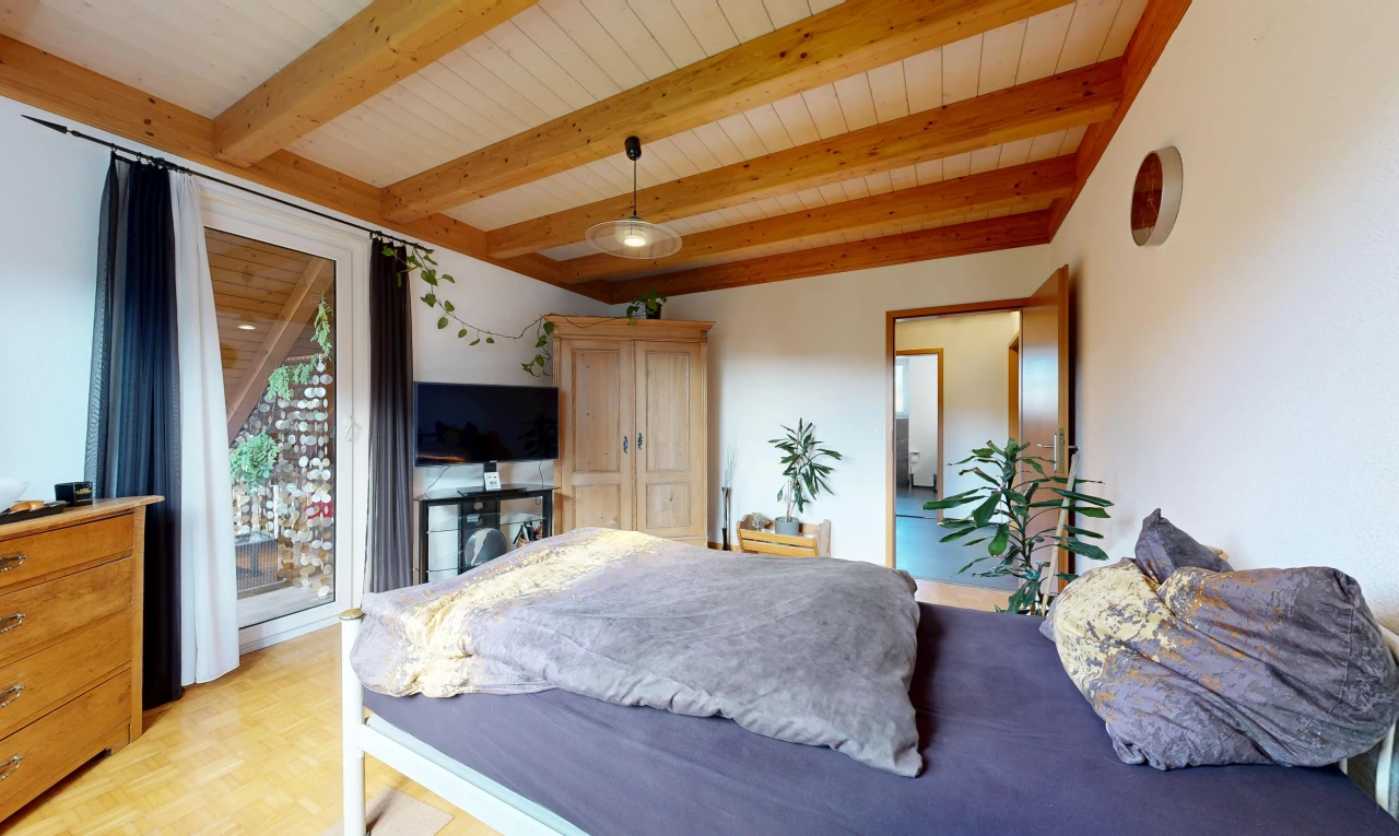room with decorative light fixtures, access to exterior, a wooden ceiling with exposed beams, and parquet floors