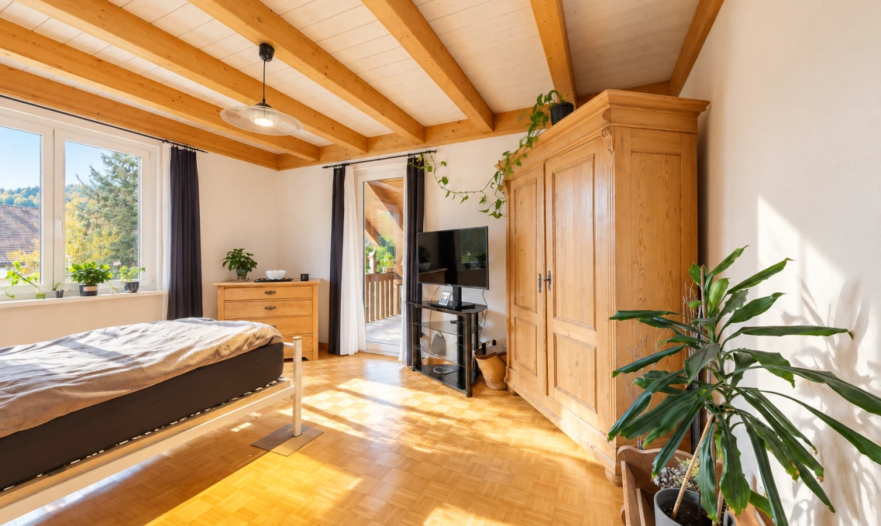 room with access to exterior, beam ceiling, parquet floors, and decorative light fixtures