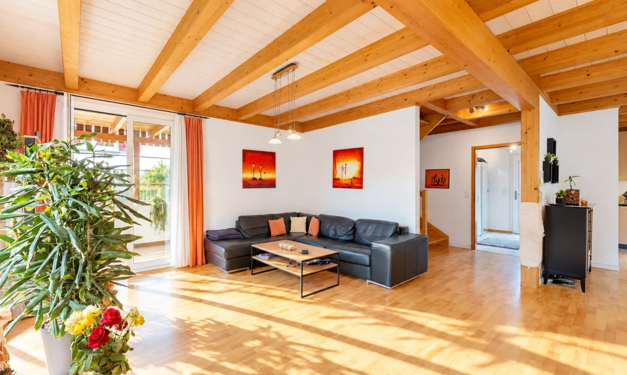 living area featuring light wood-type flooring, a wooden ceiling with exposed beams, and access to outside