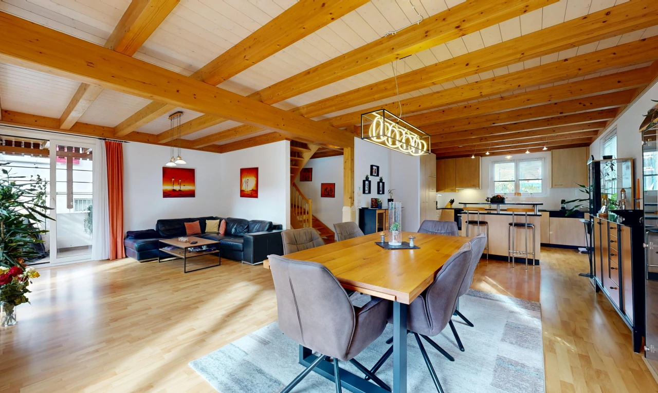 living / dining room with beamed ceiling, access to exterior, and light wood-style floors