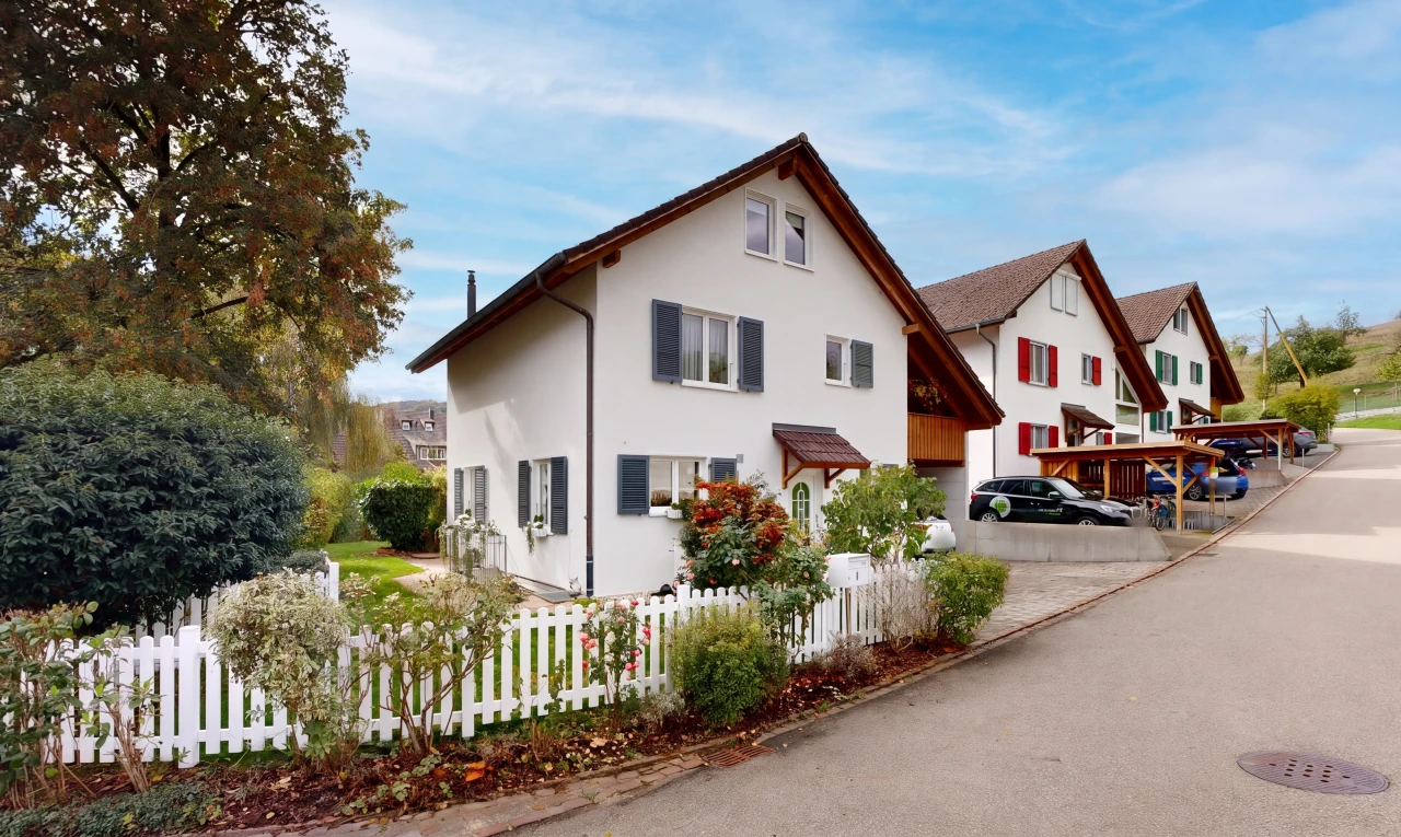 view of property with a fenced front yard and stucco siding