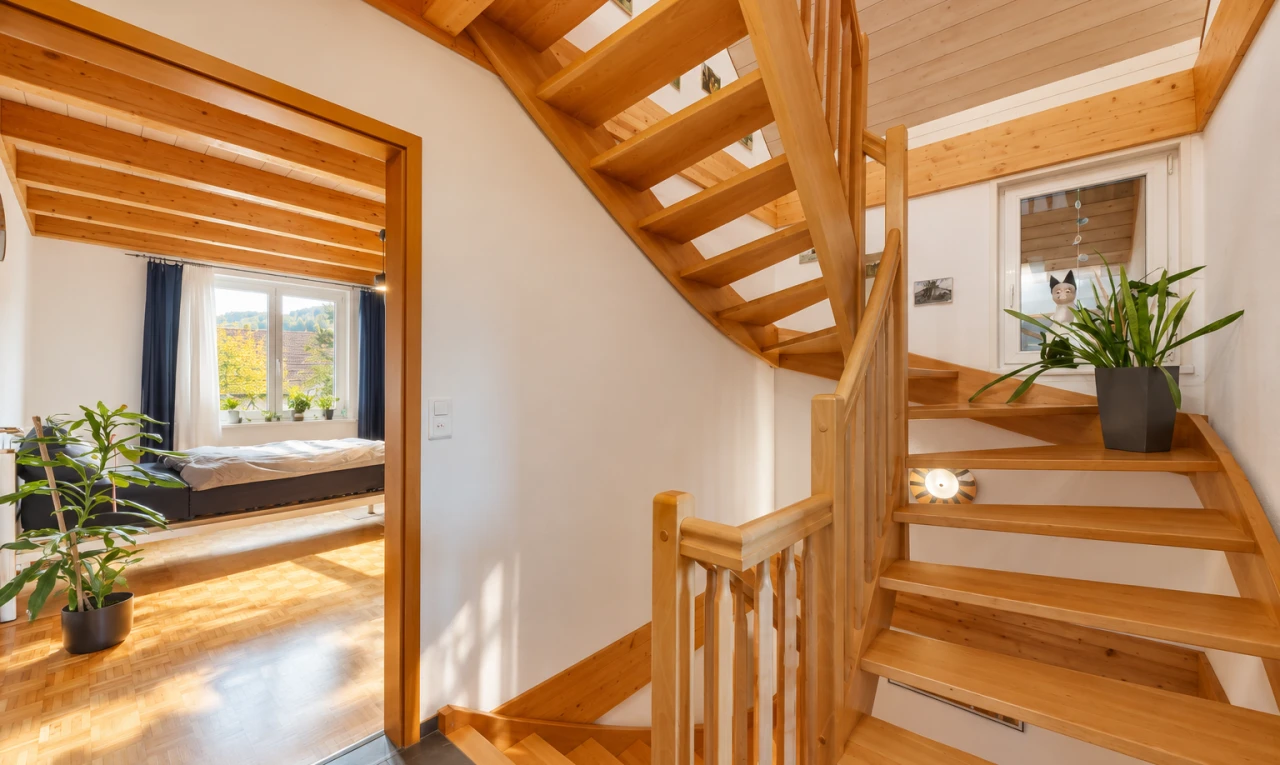 staircase with wood finished floors