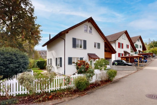 view of property with a fenced front yard and stucco siding