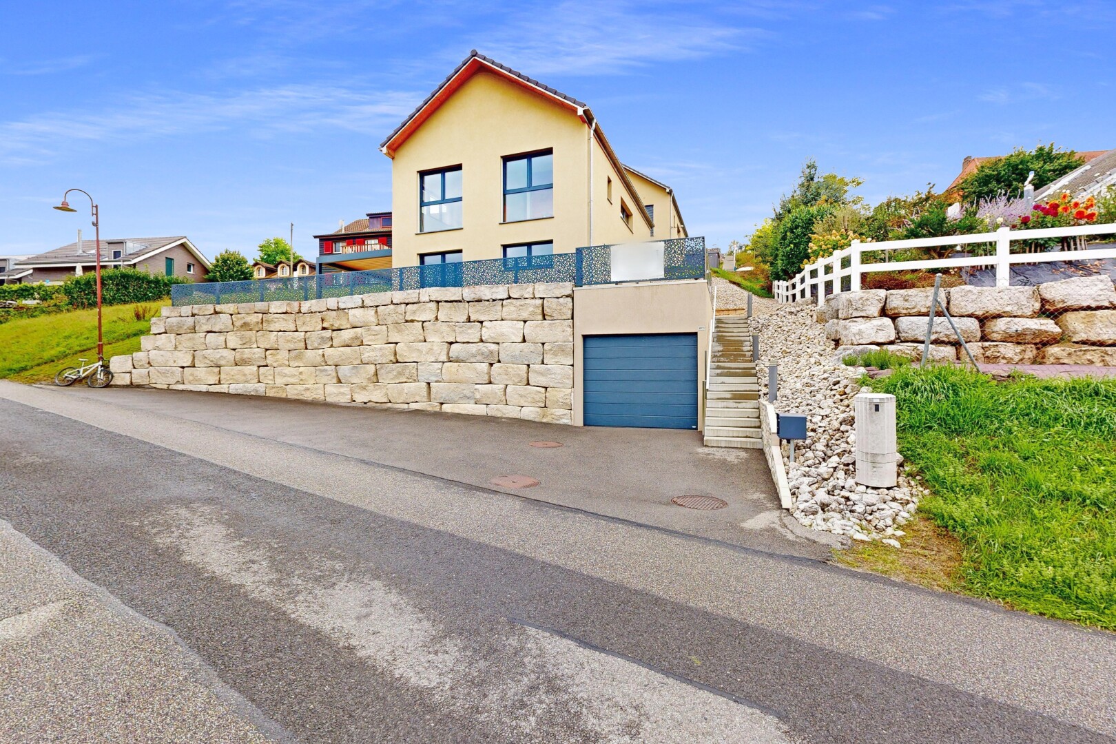 outdoor house with stucco siding and an attached garage