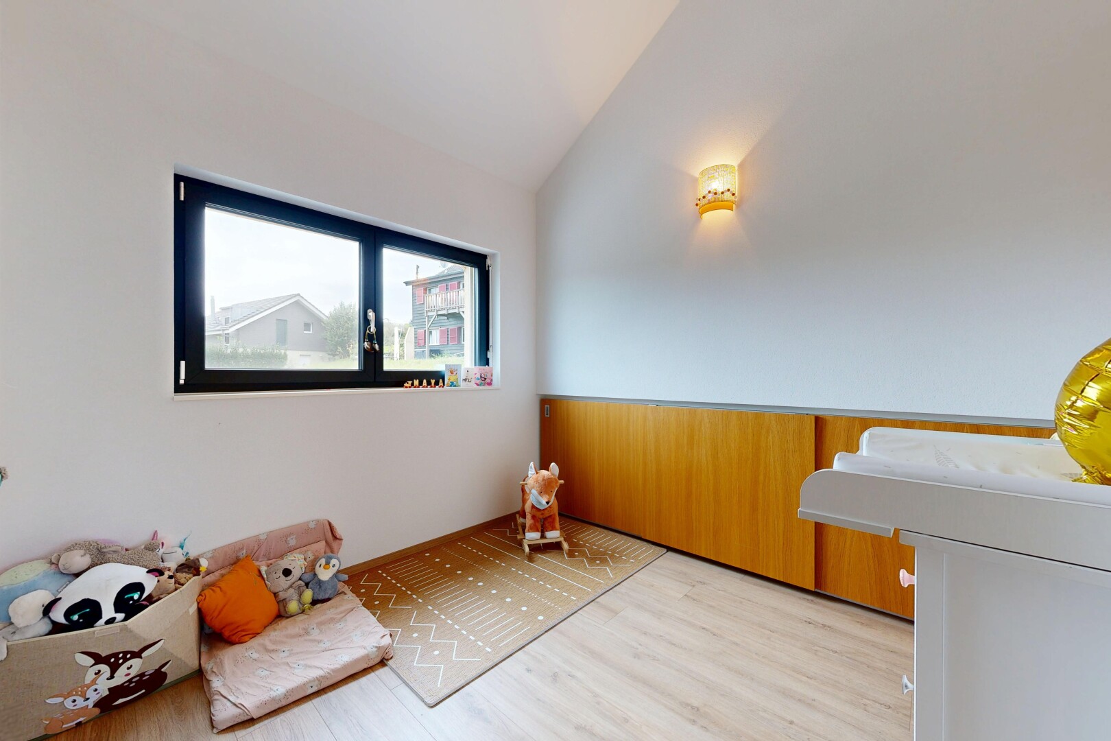 living room featuring vaulted ceiling and wood finished floors