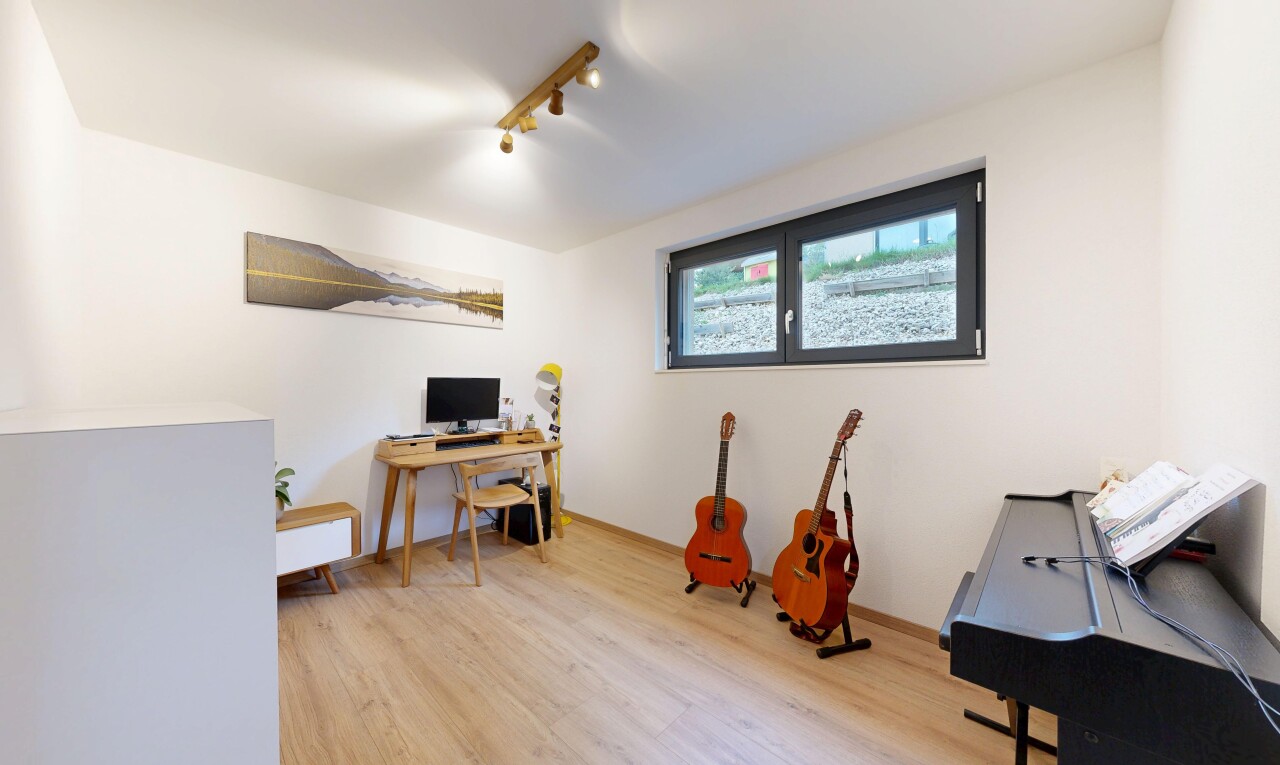 office space featuring light wood-style flooring and rail lighting
