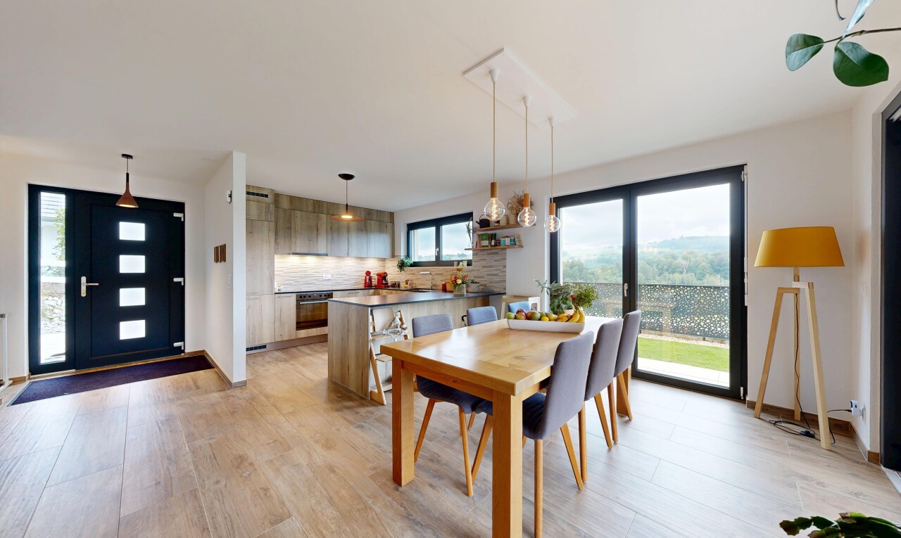 dining room with light wood finished floors and baseboards