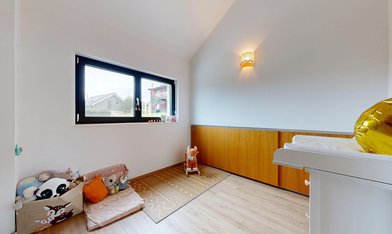 living room featuring vaulted ceiling and wood finished floors