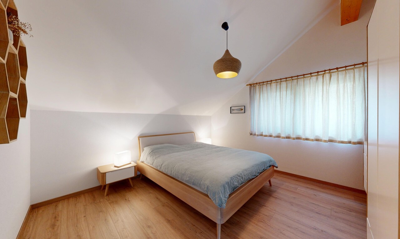 room with lofted ceiling and light wood finished floors