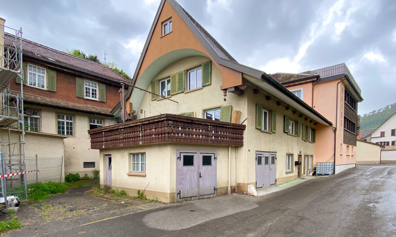 façade avec overcast, bardage en stuc, et property visible