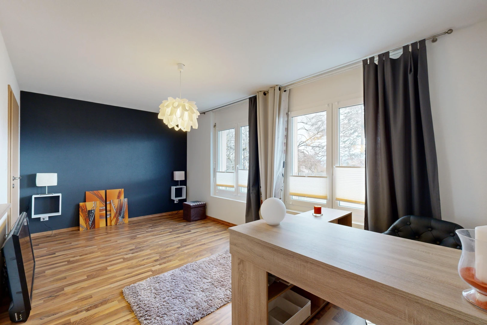 living / dining room with a notable chandelier and light hardwood / wood-style floors