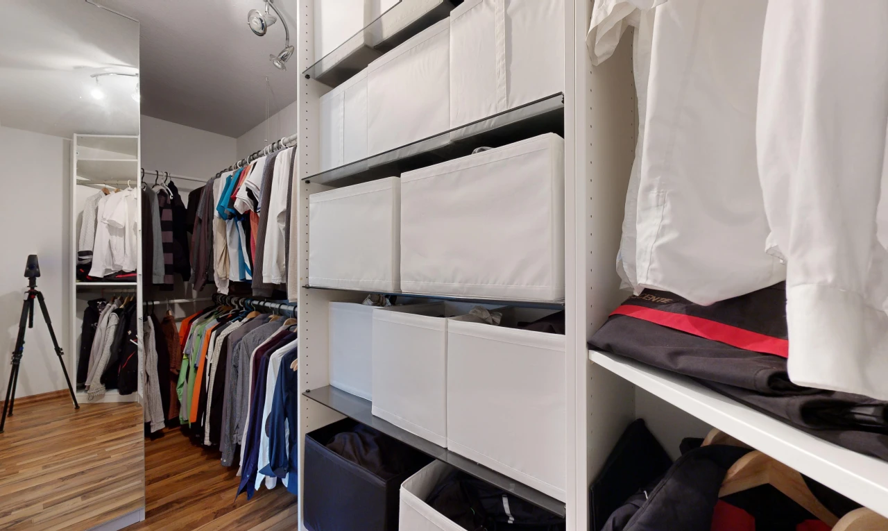 spacious closet with dark hardwood / wood-style flooring