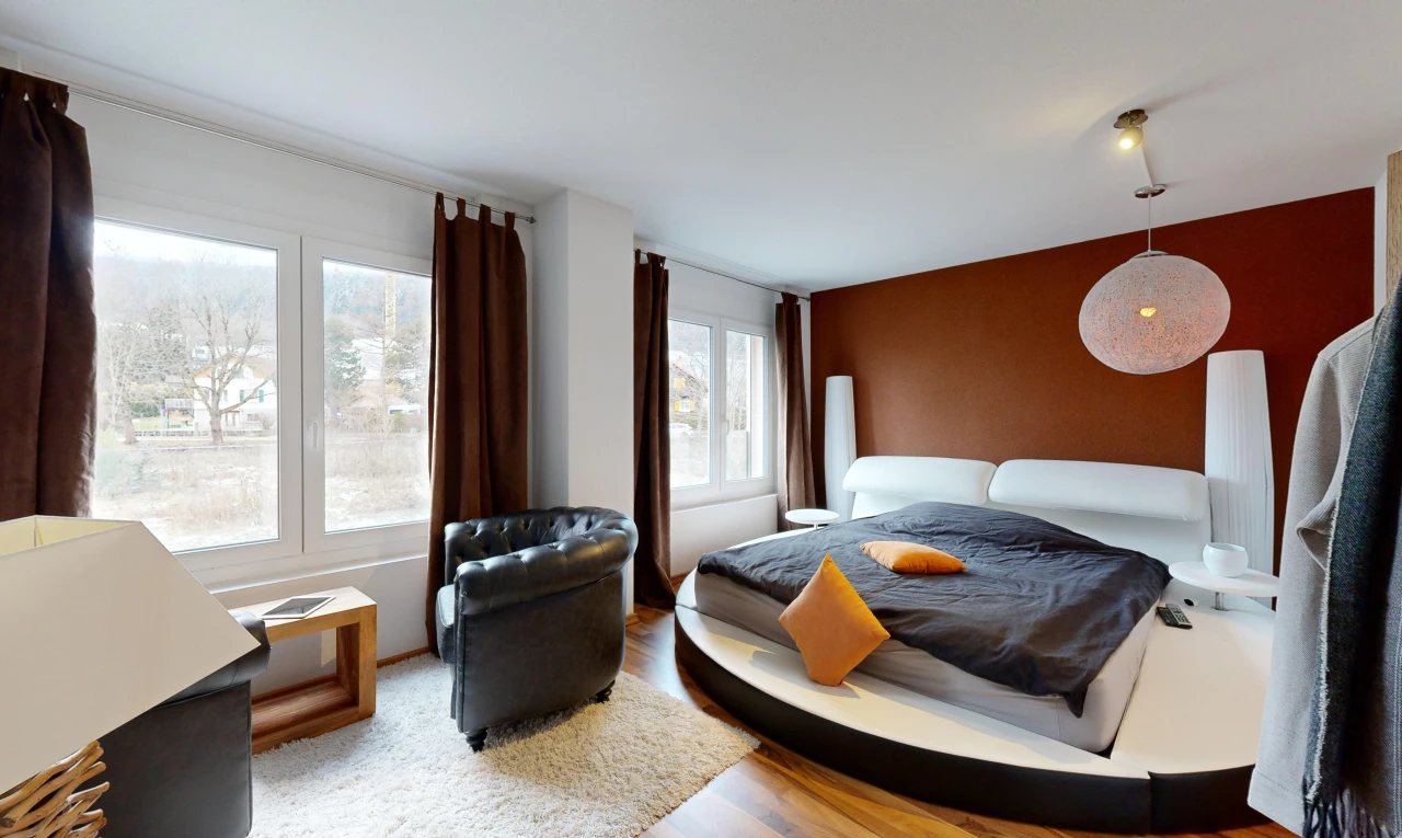 room / bedroom with multiple windows and wood-type flooring