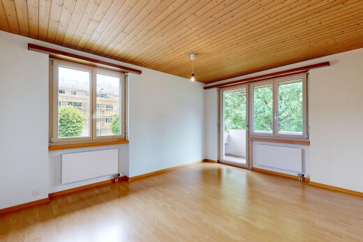 pièce vide avec inside property, radiateur, cloison sèche, drywall, et plafond en bois