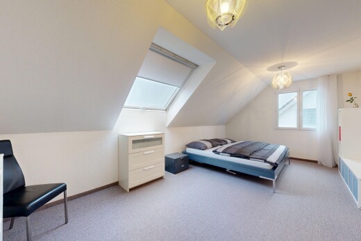 room / bedroom featuring light carpet and lofted ceiling