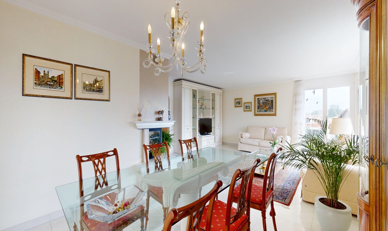 dining space featuring suspended lighting, crown molding, and light tile patterned floors